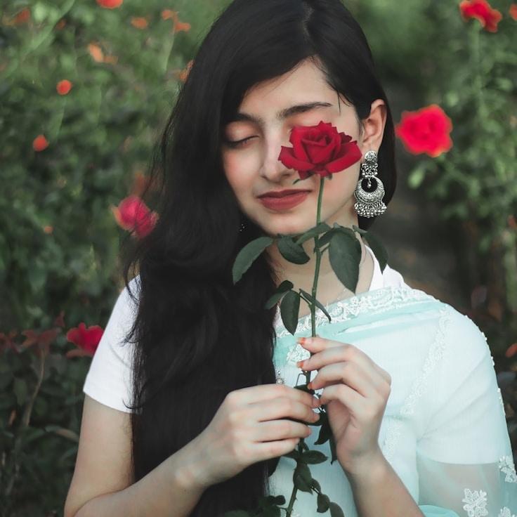 Maya Chen, Lead Design Curator at Thread Vector Panel, reviewing corporate floral arrangements
